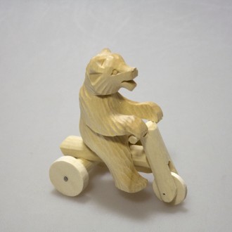 Деревянная богородская игрушка "Мишка на велосипеде"